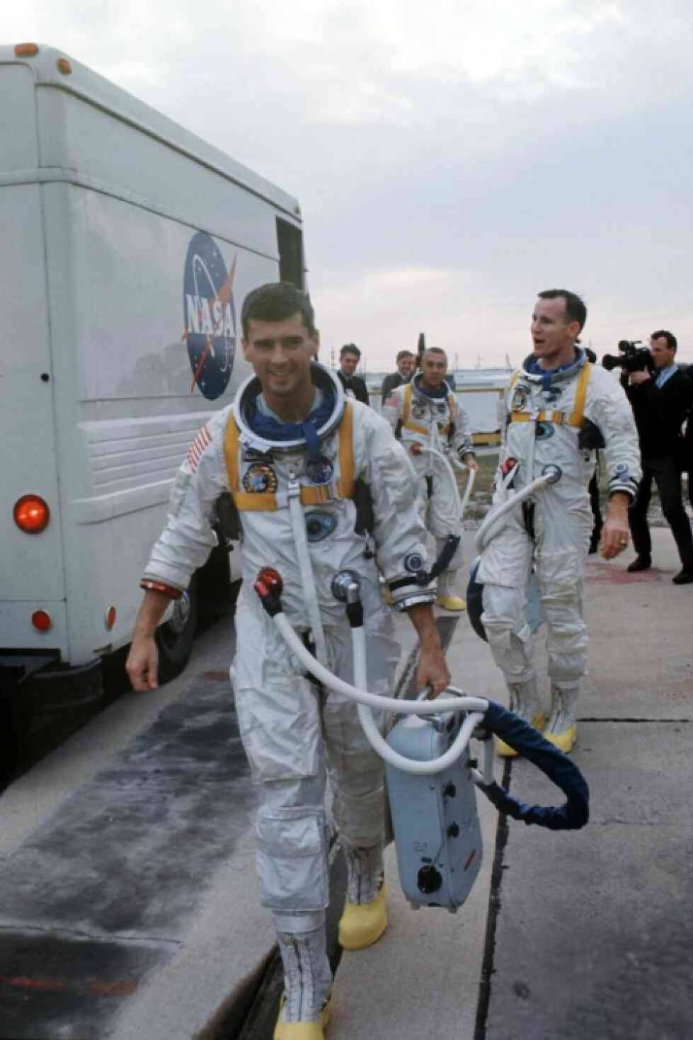 Roger walking with space suitcase